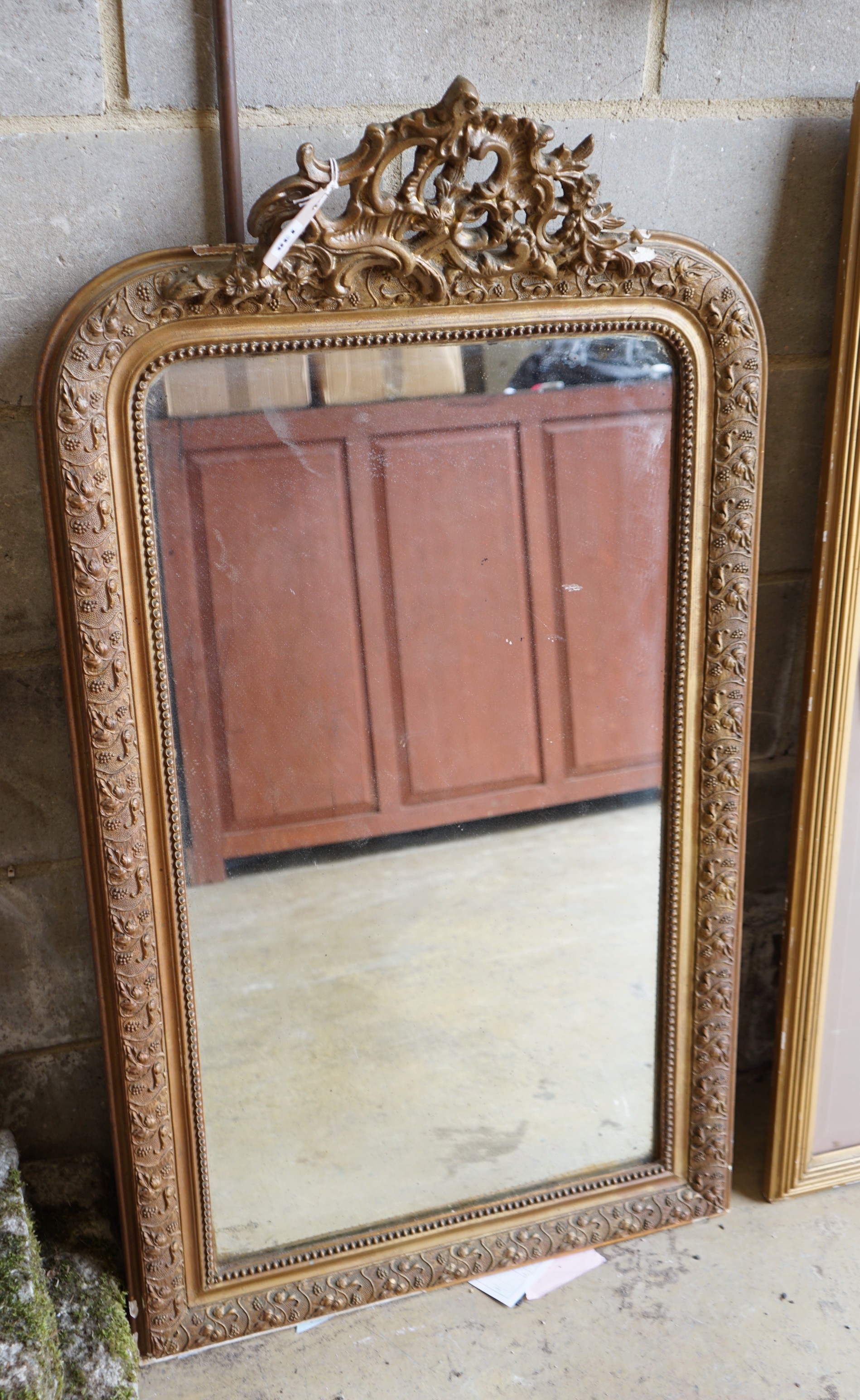 A 19th century French giltwood and gesso wall mirror (repainted), width 66cm, height 119cm